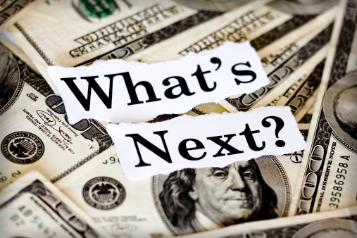 Hundred dollar bills with the words “What’s Next?”